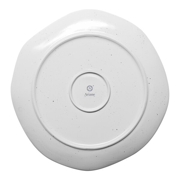 A white Ariane porcelain plate with a circular design.
