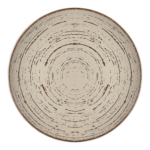 A white Ariane Tornado porcelain plate with a circular pattern on the rim.