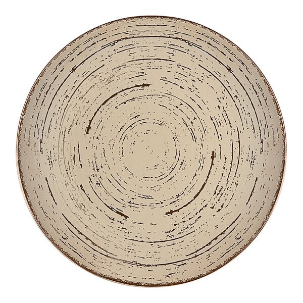 An Ariane Tornado porcelain plate with a sand dollar design on the rim.