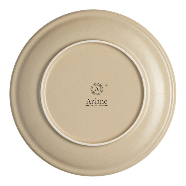 An Ariane white porcelain plate with a circular rim.
