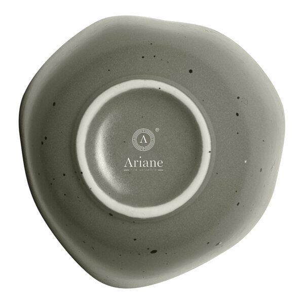 A mist green Ariane porcelain bowl with green dots on the rim.