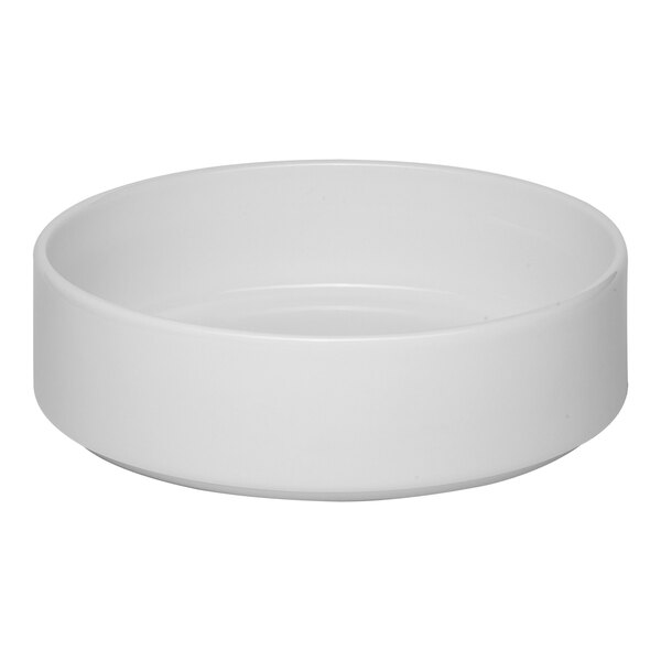 A white stackable porcelain salad bowl with a simple, round design.