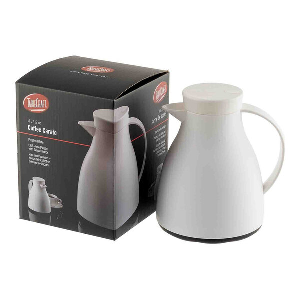 A white plastic coffee carafe with a glass liner, shown next to its packaging box.