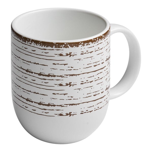 An Ariane white coupe porcelain mug with brown stripes.