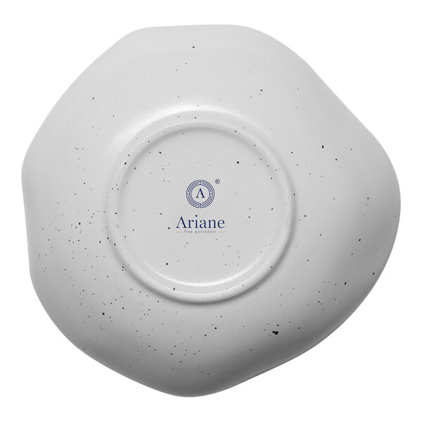 A white porcelain bowl with a black and white dots design.