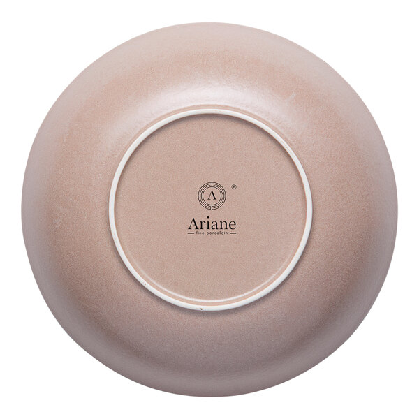 A sage green porcelain bowl with a white rim.