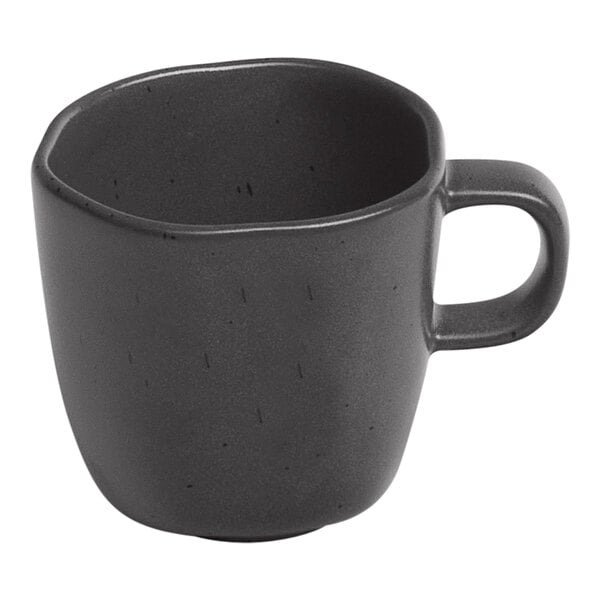 An Ariane charcoal grey porcelain espresso cup with black dots and a handle.