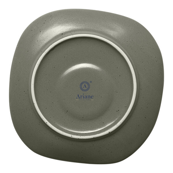 A grey Ariane porcelain saucer with a white rim and mist green dots.