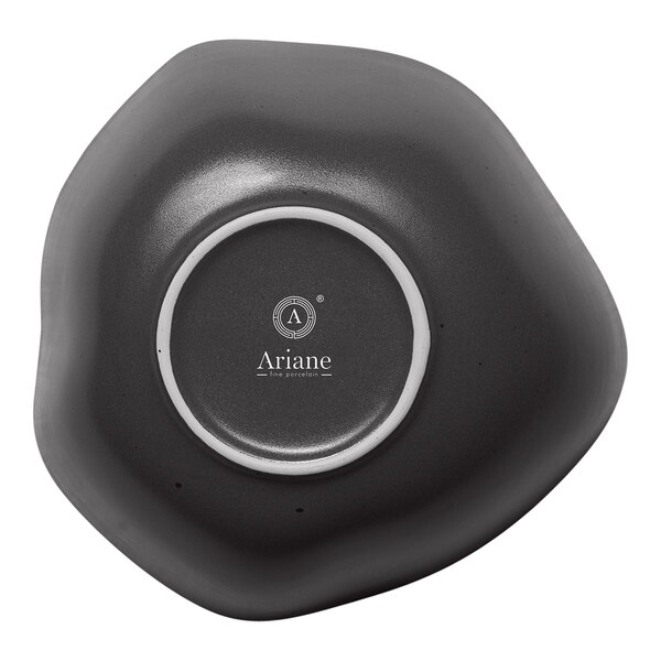 A charcoal grey Ariane Earth porcelain bowl with white dots in a white circle.