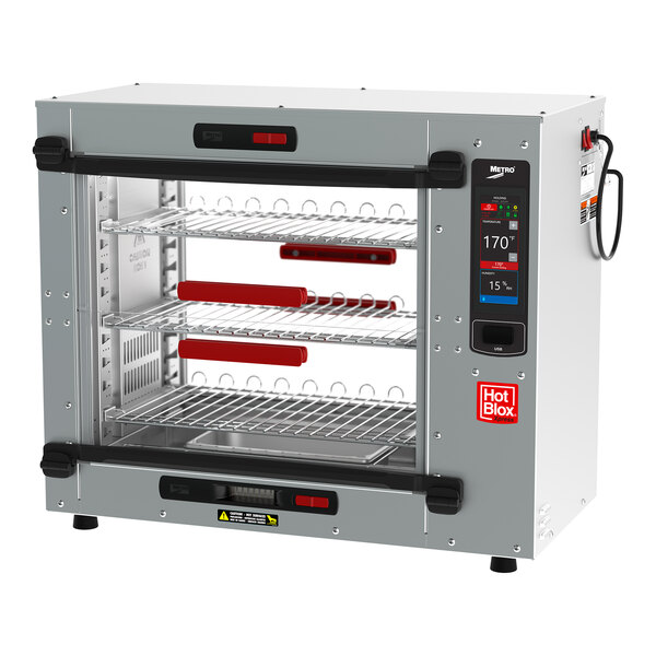 A silver Metro HotBlox countertop heated holding cabinet with shelves inside.