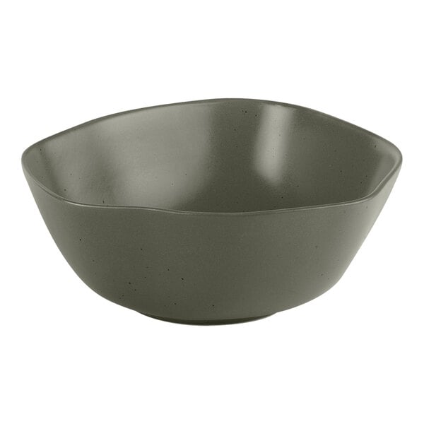 An Ariane mist green porcelain bowl with grey dots on the outside.