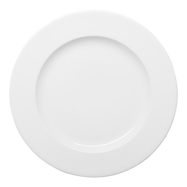 A round, wide-rimmed, warm white porcelain plate.