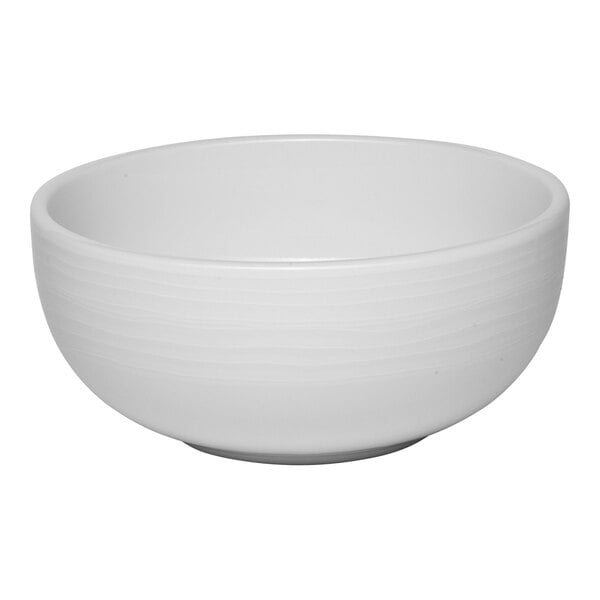 A white embossed porcelain bowl with a 27 oz. capacity.