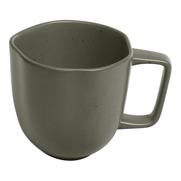 A mist green porcelain cup with grey dots and a handle.