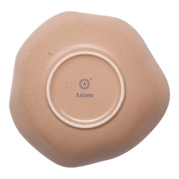 A dark sand porcelain bowl with beige dots on the inside and a white rim.