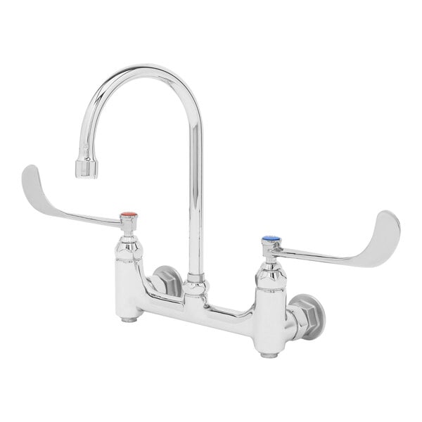 A chrome T&S surgical sink faucet with wrist action handles and a gooseneck spout.