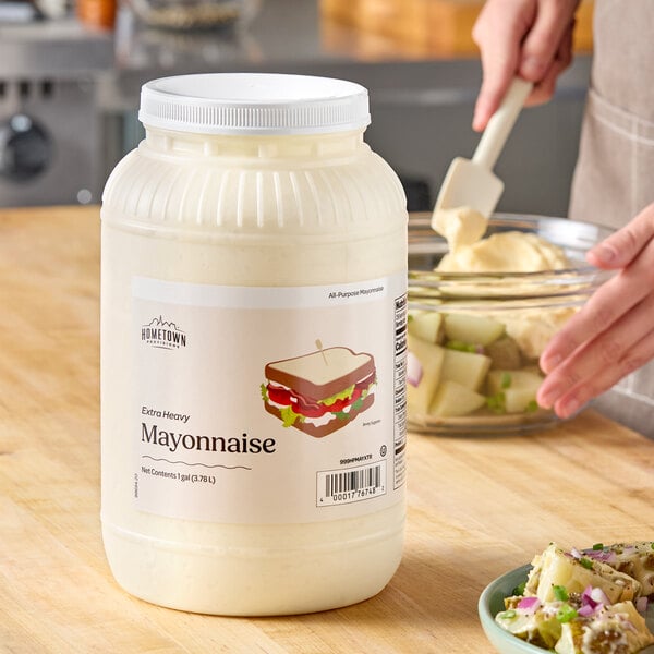 A large 1-gallon container of Hometown Provisions Extra Heavy Mayonnaise.