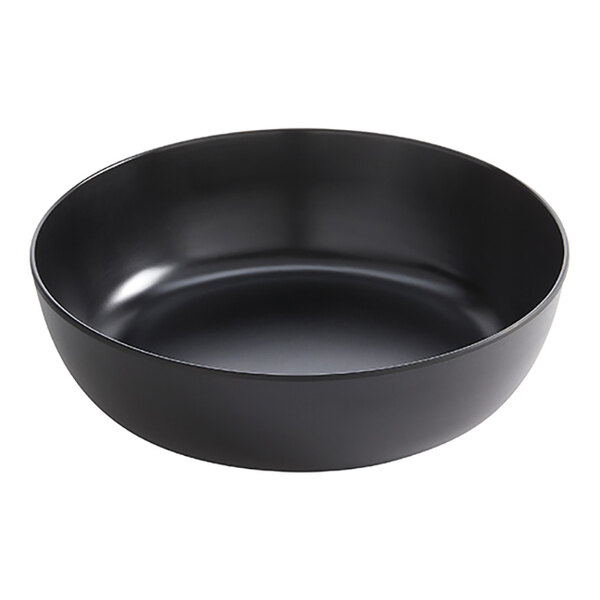 A large black round melamine serving bowl.