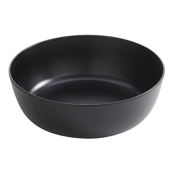 A large black round melamine serving bowl.