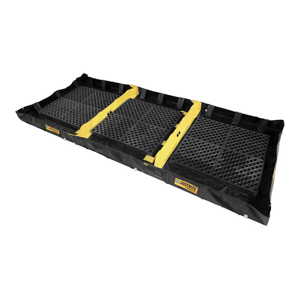 A large, foldable decontamination spill containment berm with three zones and a grated surface.