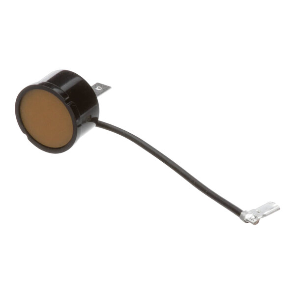 A small round black Delfield thermal overload with a wire attached.
