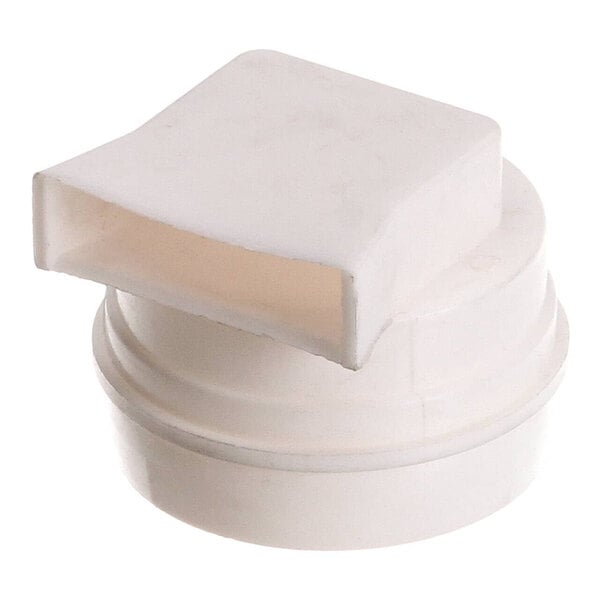 A white plastic cap with a square opening on a white surface.