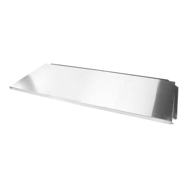 A stainless steel Traulsen assembly lid on a metal surface.