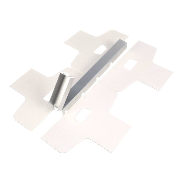 A metal piece with holes and a white rectangular object.