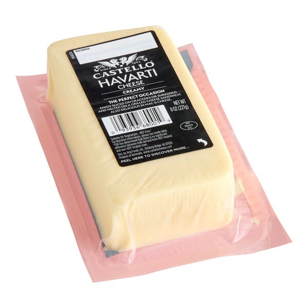 A block of Castello Creamy Havarti cheese in an 8 oz vacuum-sealed package.