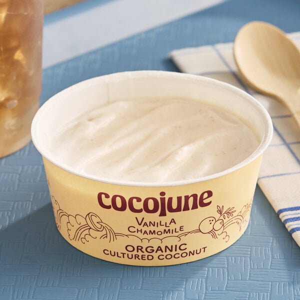 A container of Cocojune organic cultured coconut yogurt alternative in vanilla chamomile flavor.