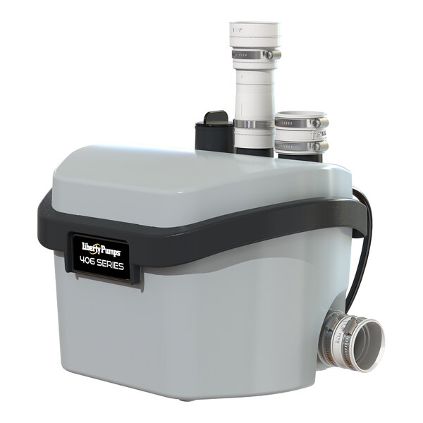 A white and black Liberty Pumps 406 compact drain pump with pipes attached.