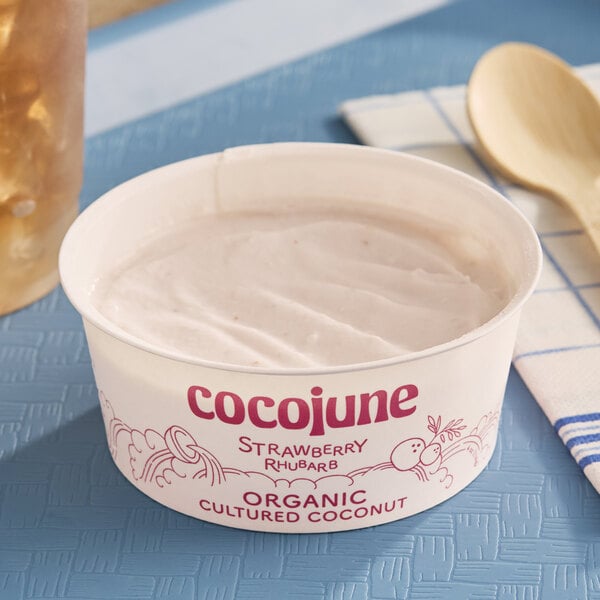 A 4 oz. container of Cocojune dairy-free strawberry rhubarb coconut cultured yogurt alternative.