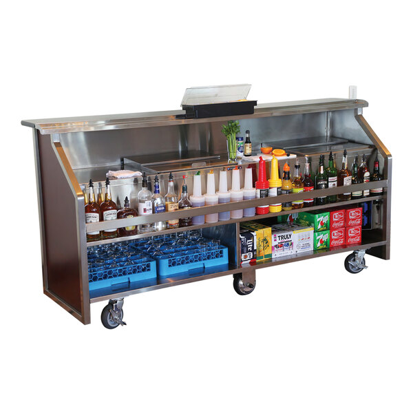 A portable bar with a red maple laminate and stainless steel finish, featuring an electric setup, fixed speed rail, two 40 lb. ice bins, and storage for bottles, glasses, and mixers.