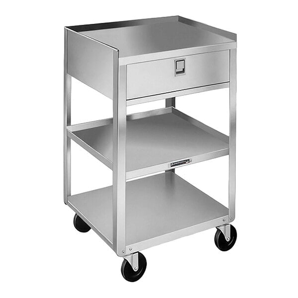 A stainless steel equipment stand with three shelves, a drawer, and casters.
