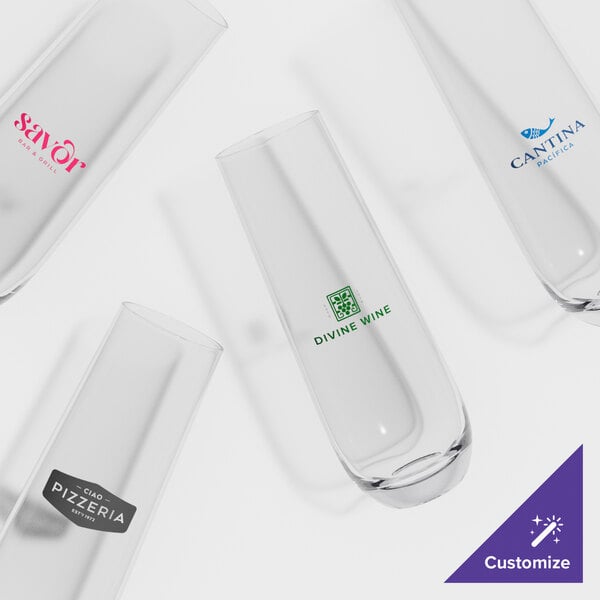 A set of customizable stemless flute glasses with various printed logos.