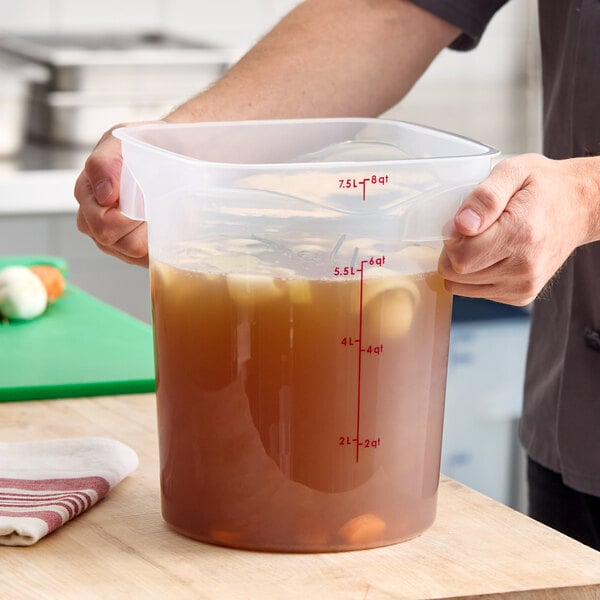 A translucent round 8-quart polypropylene food storage container with red measurement markings.