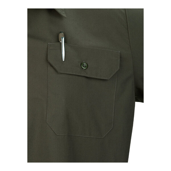 A close-up of an olive green short sleeve work shirt with a buttoned chest pocket and a pen clipped to the pocket.