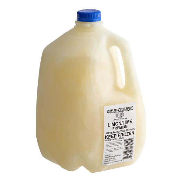 A gallon jug of lime agua fresca concentrate with a blue cap and labeled for freezing.