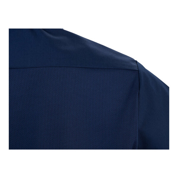 A close-up of the back shoulder area of a navy blue short sleeve work shirt.