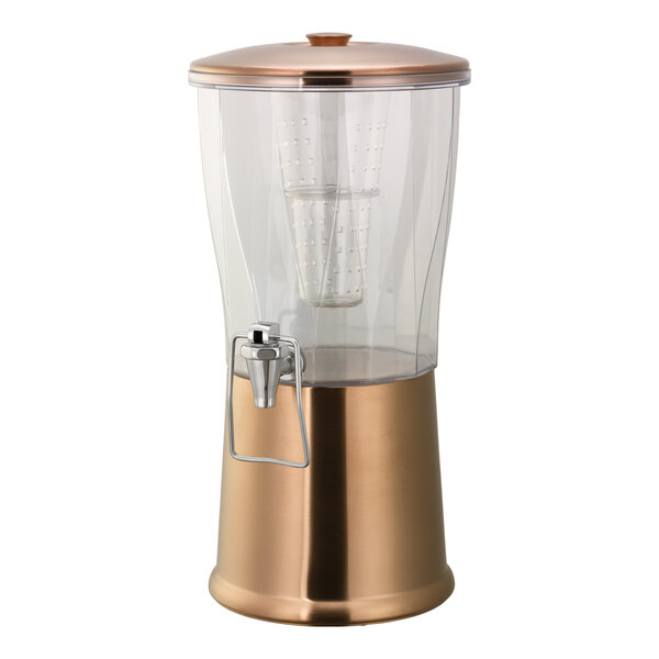 A 3-gallon round cold beverage dispenser with a metallic rose gold stainless steel base, clear Tritan plastic container, hands-free spigot, and an infuser tube.