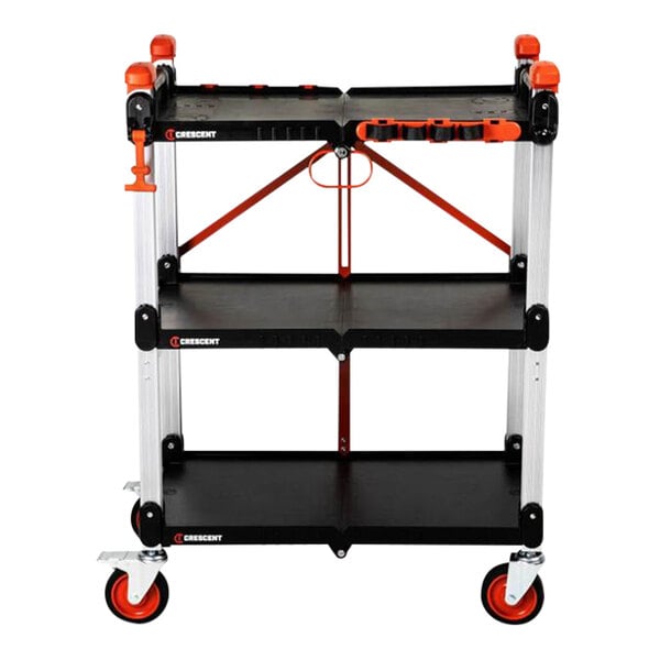 A three-shelf foldable jobsite cart with wheels and a black and orange color scheme.