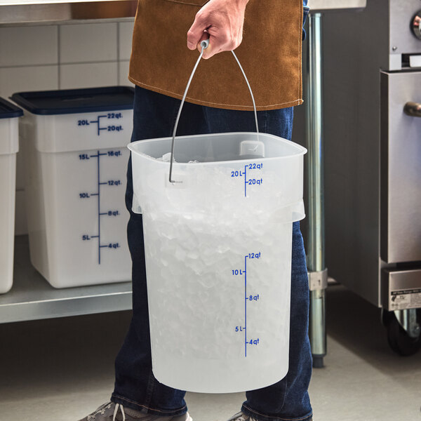 A translucent 22-quart round food storage pail with a bail handle, partially filled with ice.