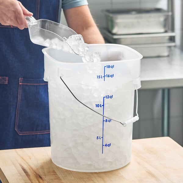 A translucent round food storage pail with blue measurement markings and a metal bail handle, partially filled with ice.