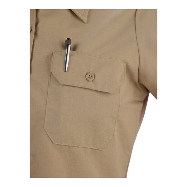 A khaki short sleeve work shirt in size 2XL with a buttoned chest pocket holding a pen.