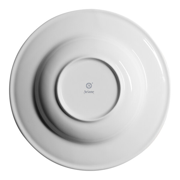 A white round embossed wide rim deep porcelain plate viewed from the bottom.