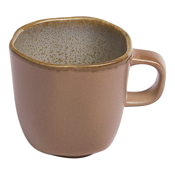 A small gold and brown porcelain espresso cup with a handle.