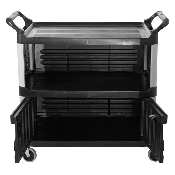 A black Rubbermaid equipment cart with two shelves and lockable doors.