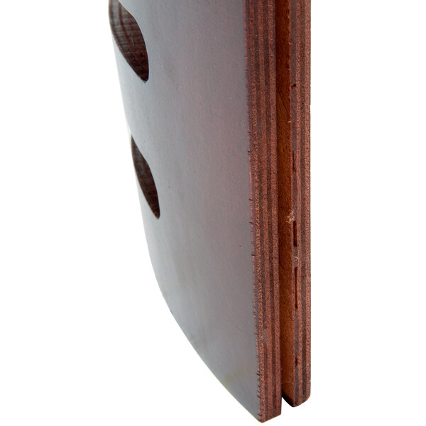 A wooden bistro chair backrest with a mahogany finish.
