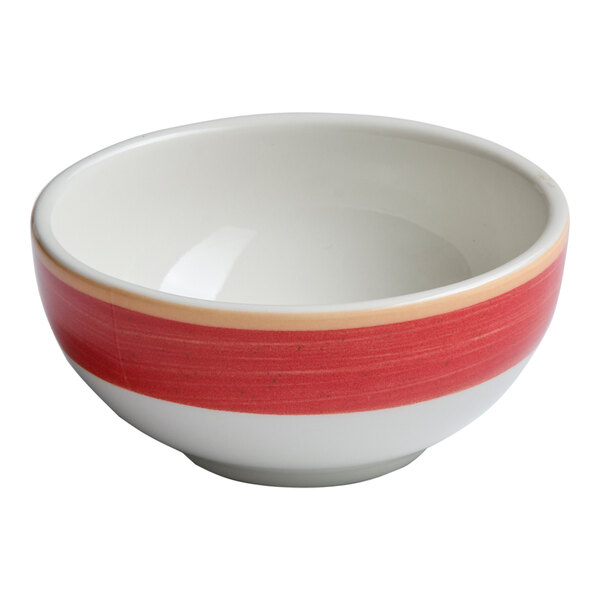 A small round porcelain bowl with a red and white two-tone design.