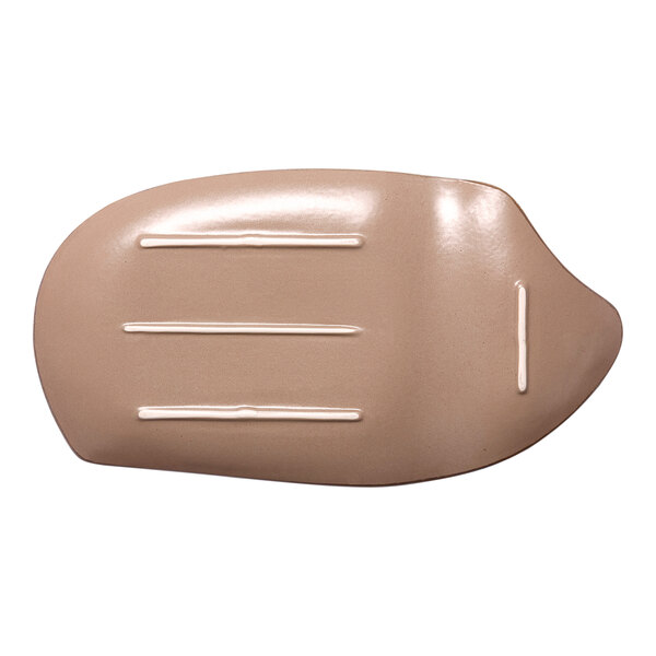 An irregularly shaped gold and brown porcelain plate with a glossy finish and subtle linear accents.